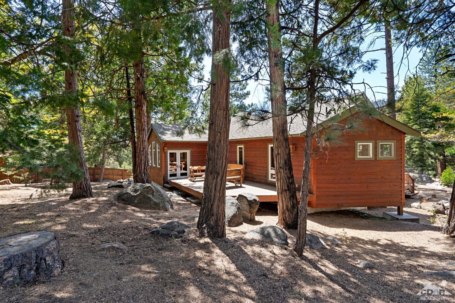 24838 Fern Valley Road Idyllwild, CA 92549 - Photo 29 of 38 a view of a house with a yard tree and wooden fence