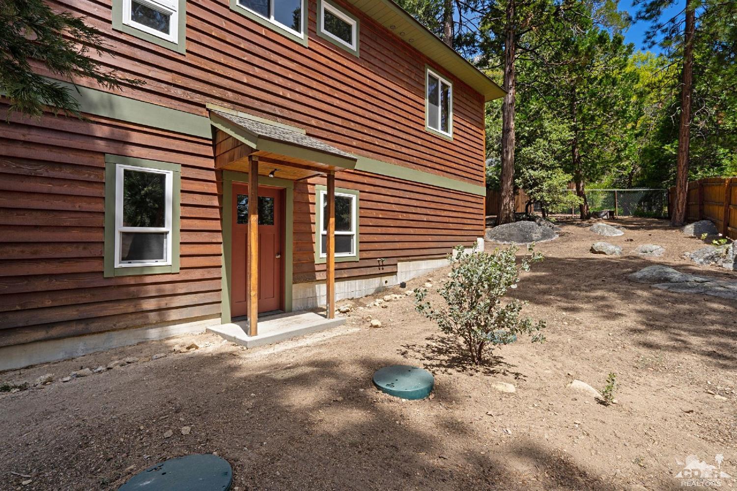 24838 Fern Valley Road Idyllwild, CA 92549 - Photo 34 of 38 a view of a house with a yard