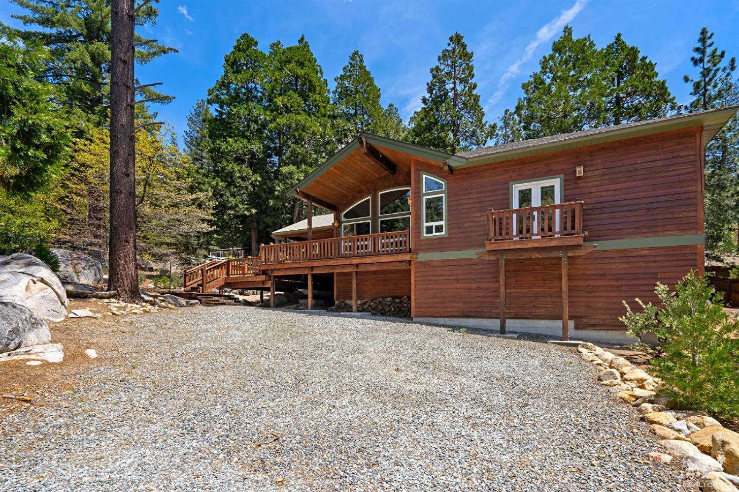 24838 Fern Valley Road Idyllwild, CA 92549 - Photo 37 of 38 a view of a house with a yard and garage