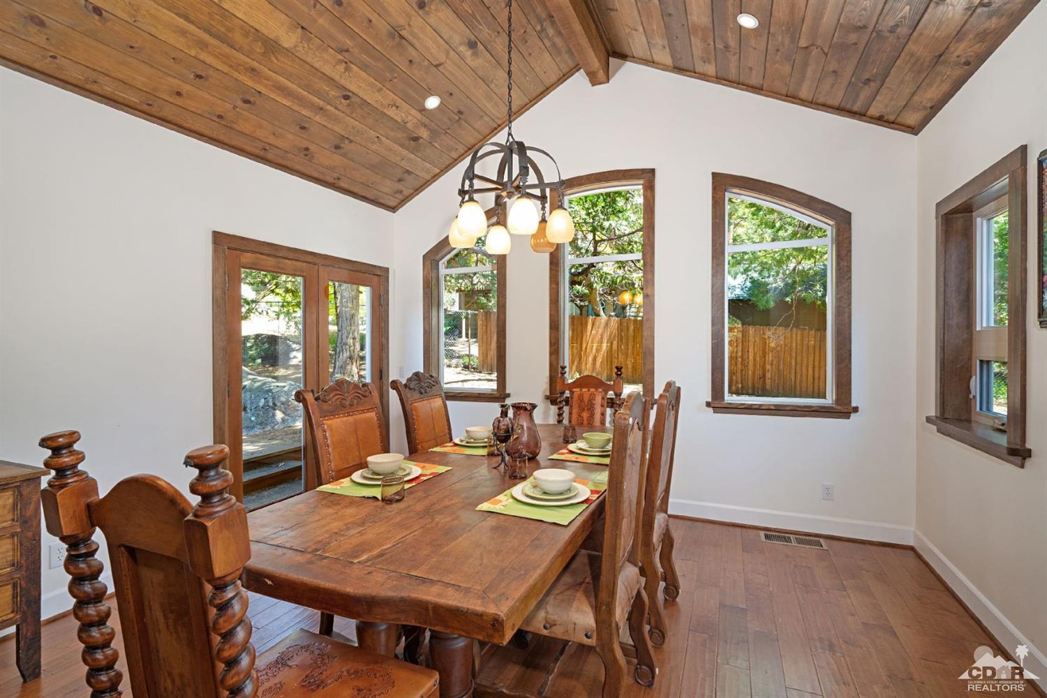 24838 Fern Valley Road Idyllwild, CA 92549 - Photo 5 of 38 a view of a dining room with furniture window and outside view