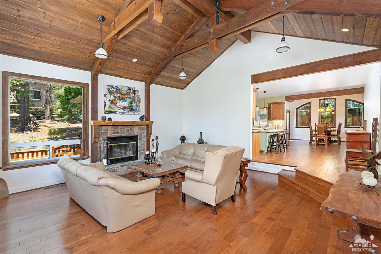 24838 Fern Valley Road Idyllwild, CA 92549 - Photo 6 of 38 a living room with furniture and a fireplace