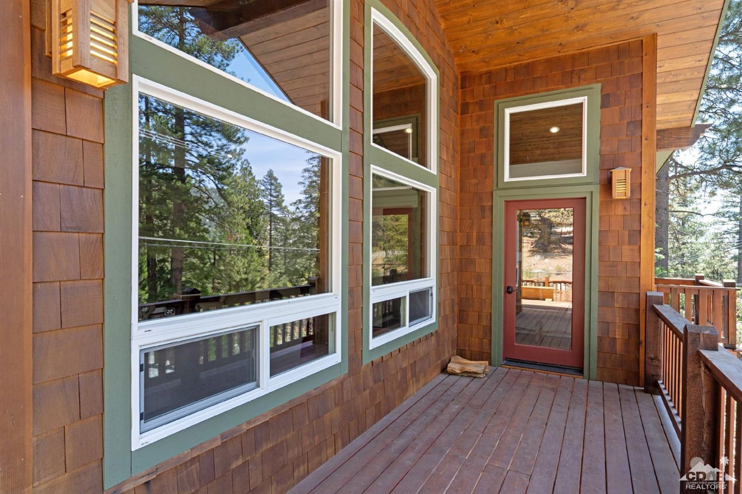 24838 Fern Valley Road Idyllwild, CA 92549 - Photo 7 of 38 a view of a house with a large window