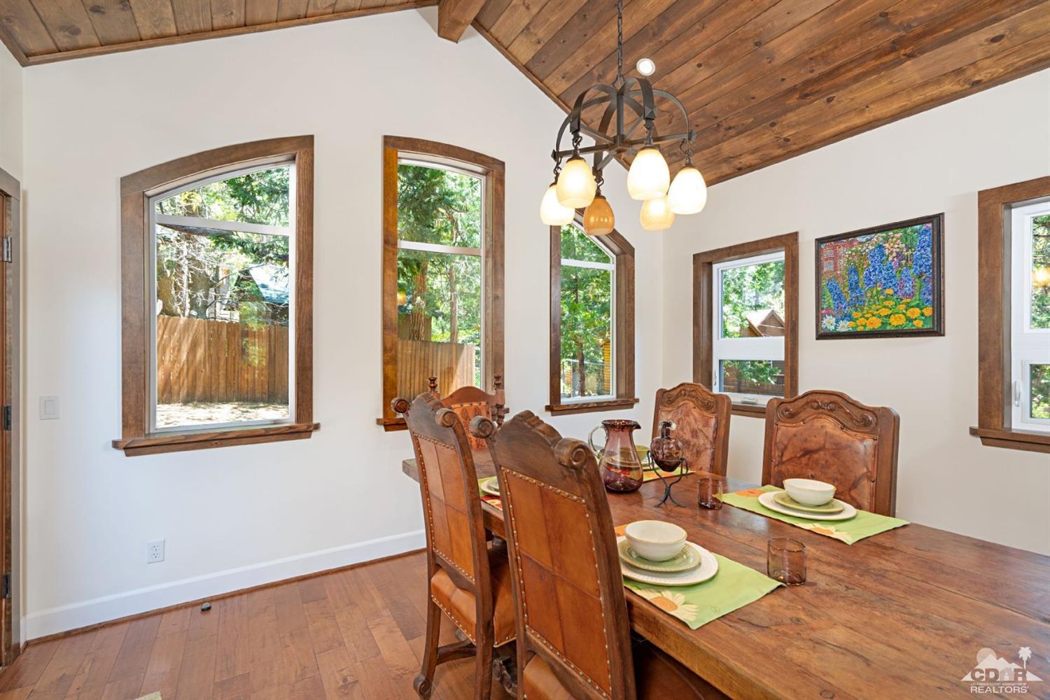 24838 Fern Valley Road Idyllwild, CA 92549 - Photo 10 of 38 a living room with furniture and floor to ceiling windows