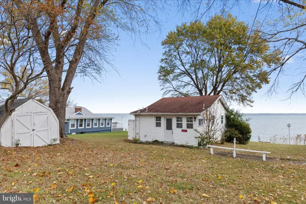 a house that has a tree in front of it