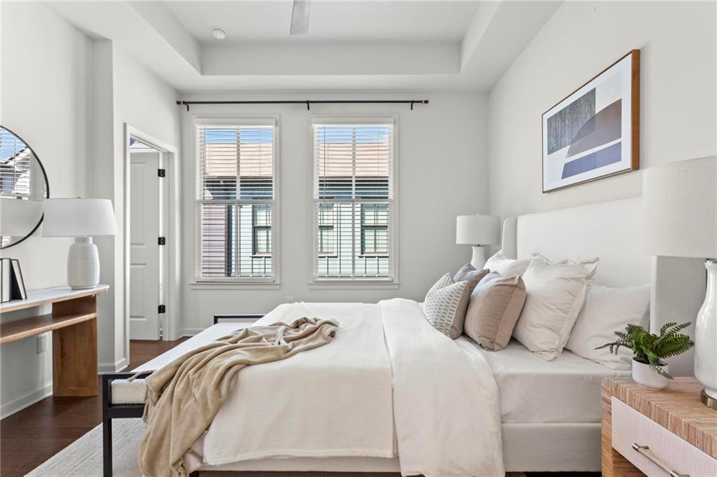 718 Needletail Way Atlanta, GA 30312 - Photo 18 of 44 a bedroom with bed and a large window