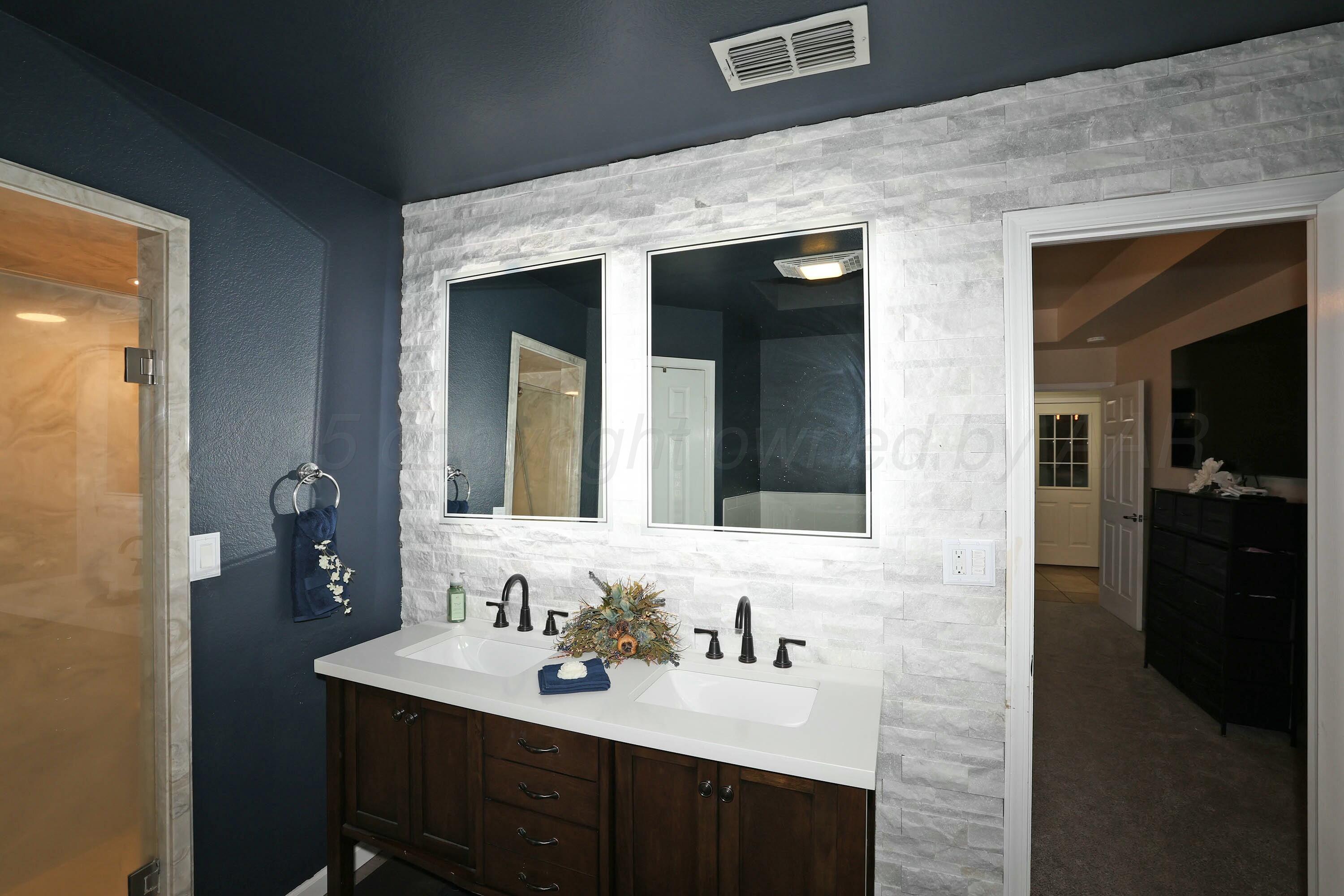 800 West McAfee Road Amarillo, TX 79118 - Photo 17 of 39 a bathroom with a sink and a mirror