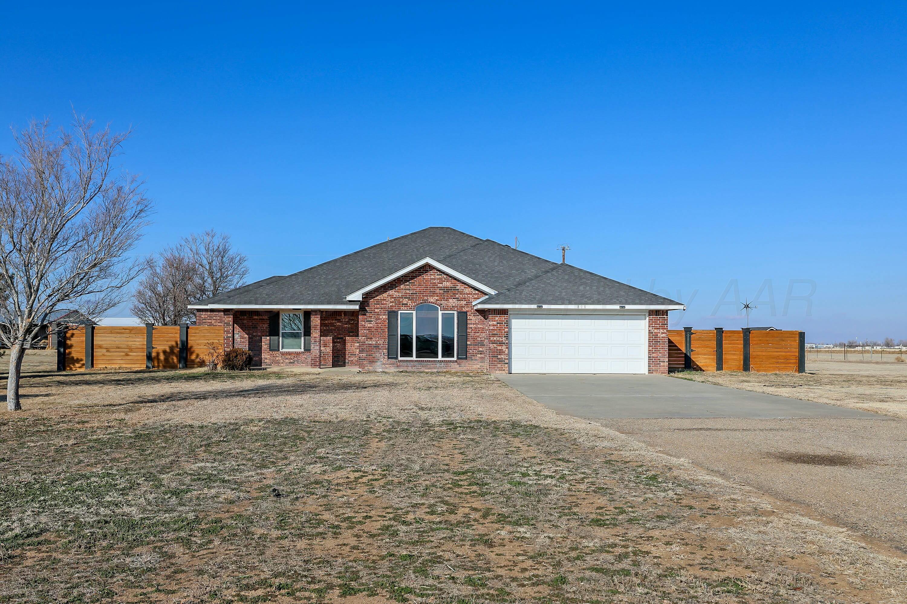 800 West McAfee Road Amarillo, TX 79118 - Photo 3 of 39 a front view of a house with a yard