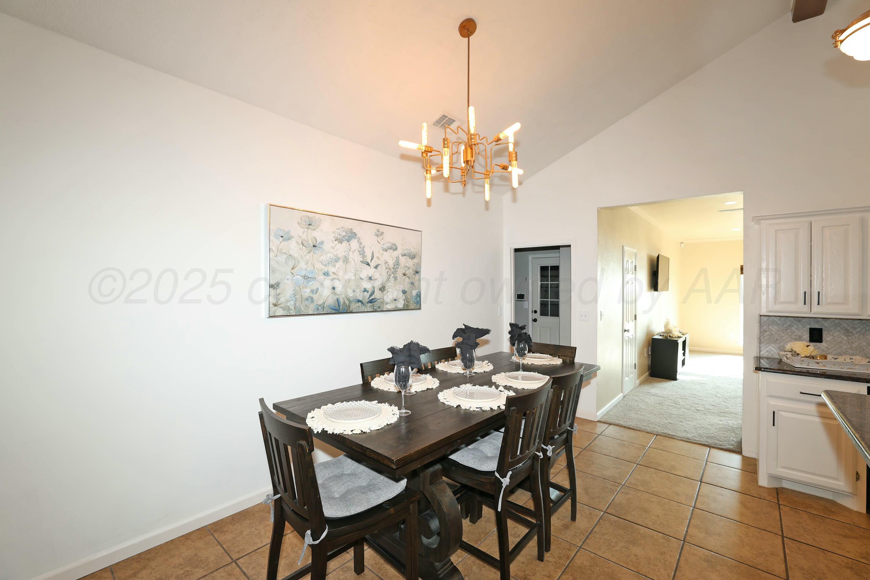 800 West McAfee Road Amarillo, TX 79118 - Photo 7 of 39 a view of a dining room with furniture and chandelier