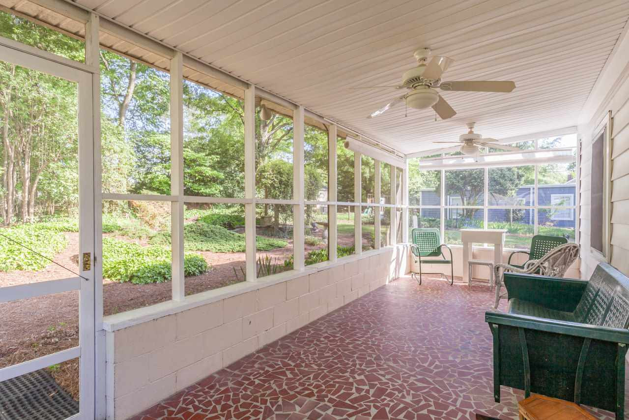 1306 Courtland Drive Raleigh, NC 27604 - Photo 17 of 22 The screened porch in the back is 28 feet wide. So much space for almost anything you can think of, and overlooking your enormous yard.