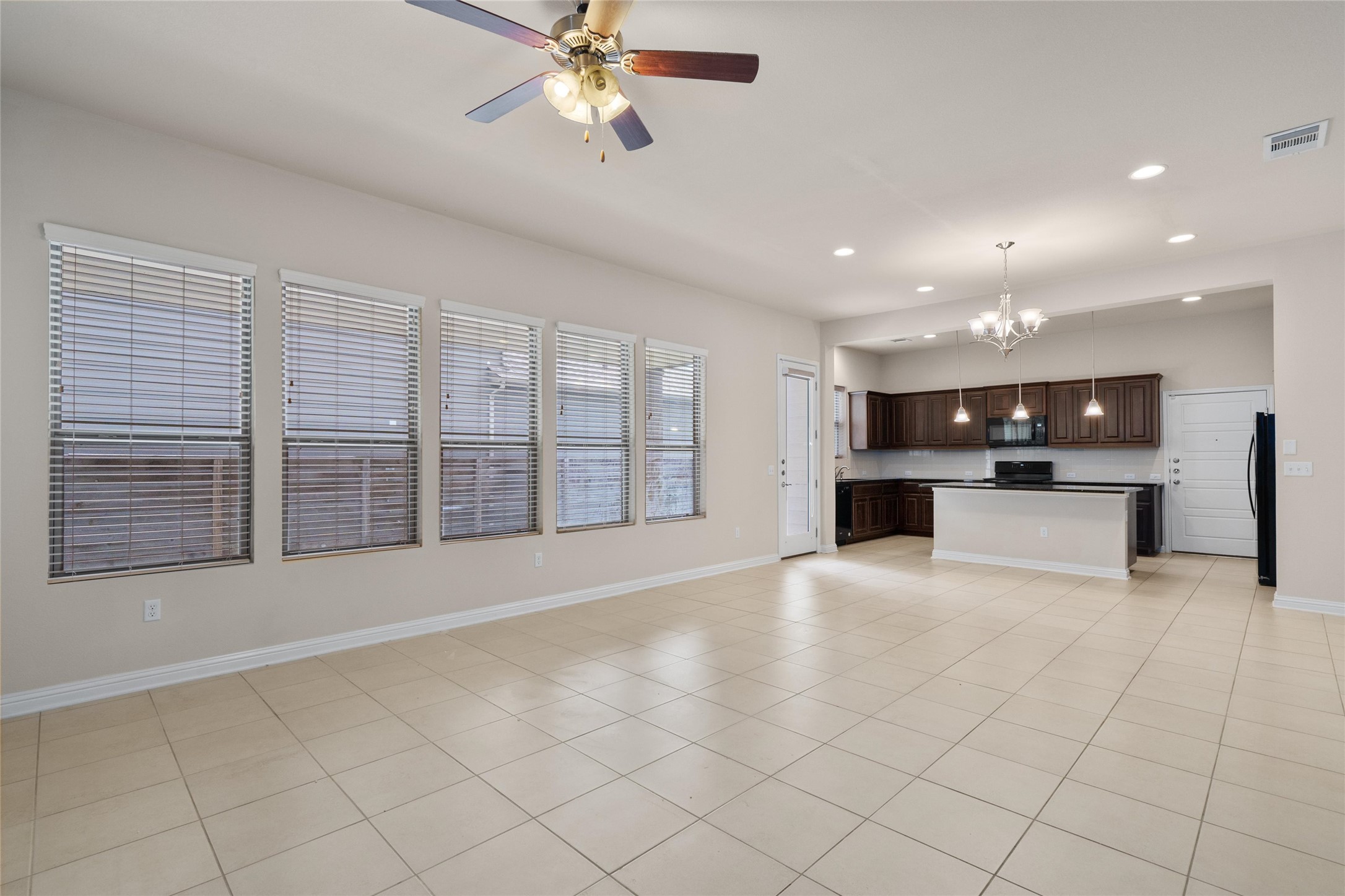 6907 Idea Road Austin, TX 78741 - Photo 34 of 36 a view of an empty room with a kitchen