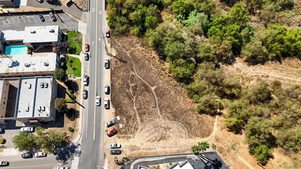 an aerial view of residential house with parking space