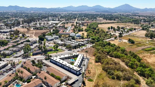 an aerial view of residential house and sandy dunes