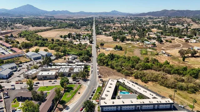 an aerial view of residential house and sandy dunes