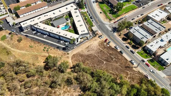 a view of a yard with an outdoor seating