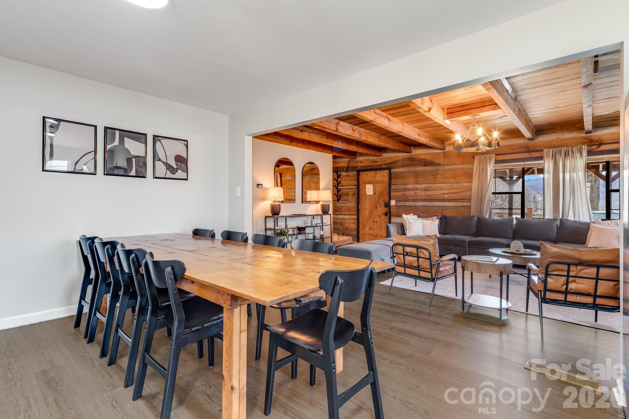 114 Johns Creek Road Canton, NC 28716 - Photo 12 of 48 a dining room with furniture and wooden floor