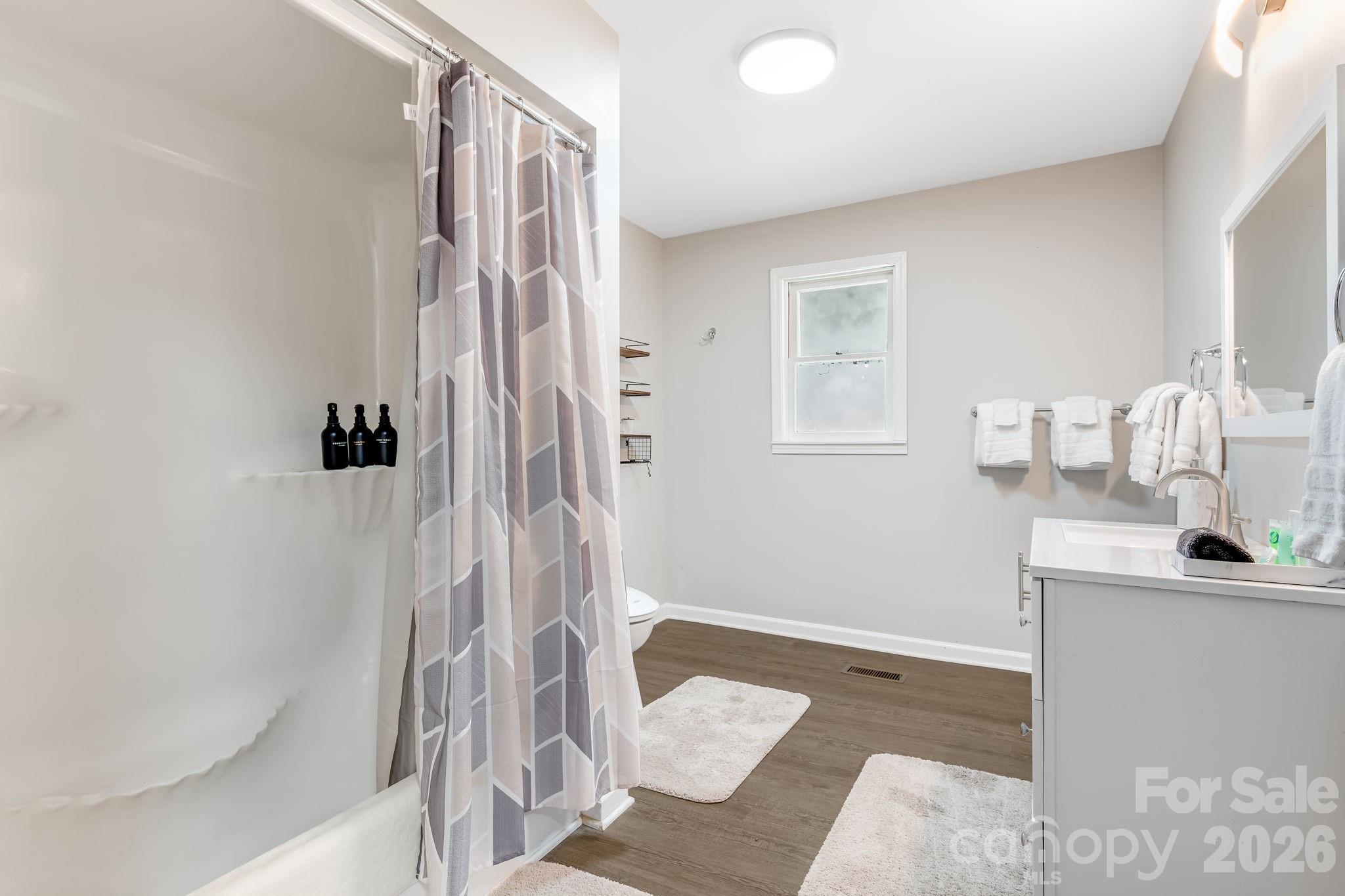 114 Johns Creek Road Canton, NC 28716 - Photo 14 of 48 a bathroom with a sink and a mirror
