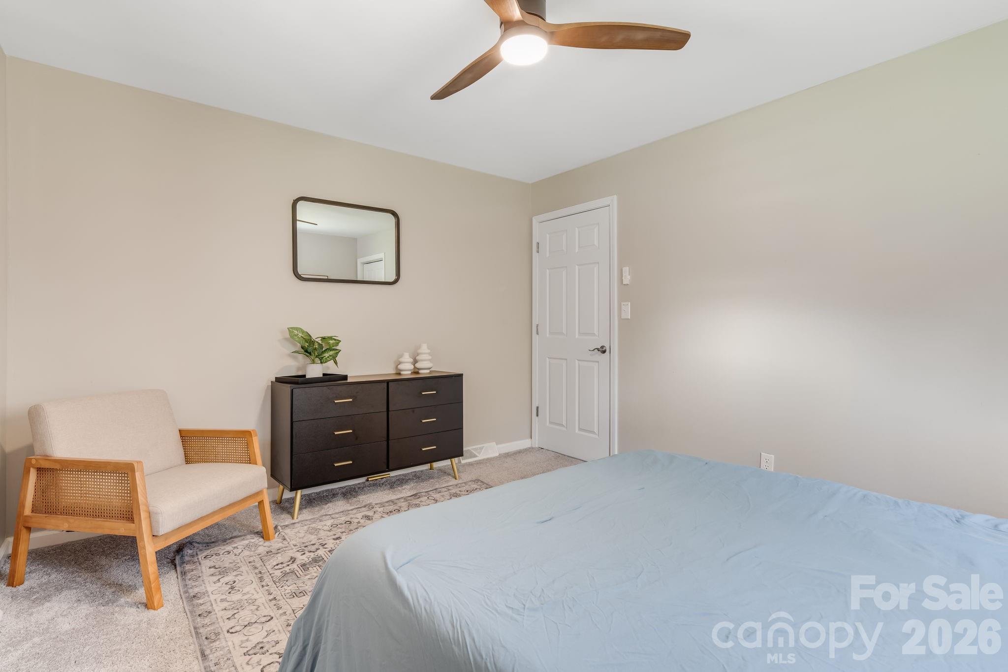 114 Johns Creek Road Canton, NC 28716 - Photo 17 of 48 a bedroom with a bed and a dresser