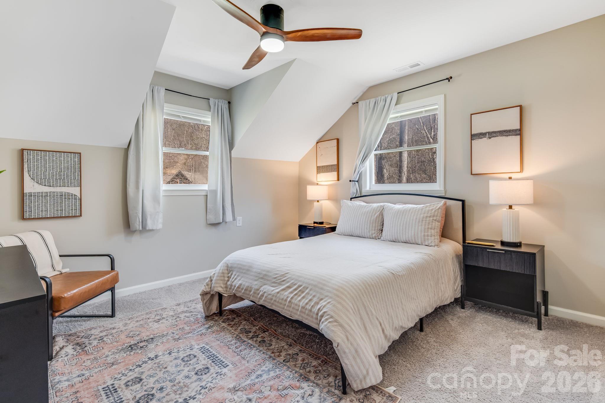 114 Johns Creek Road Canton, NC 28716 - Photo 20 of 48 a bedroom with a bed and wooden floor