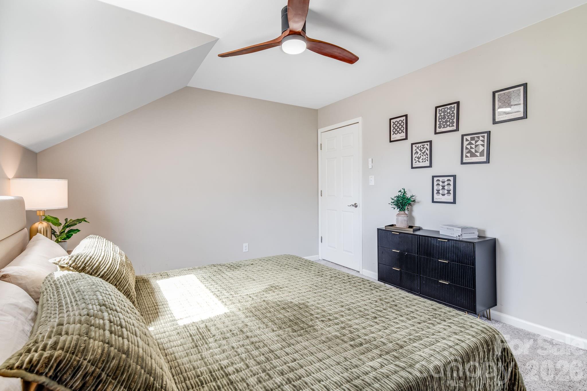 114 Johns Creek Road Canton, NC 28716 - Photo 23 of 48 a bedroom with a bed and a dresser