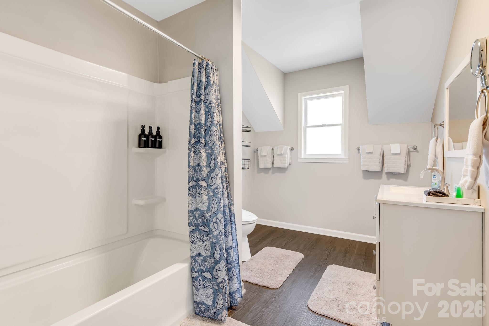 114 Johns Creek Road Canton, NC 28716 - Photo 24 of 48 a bathroom with a bathtub a sink and a shower