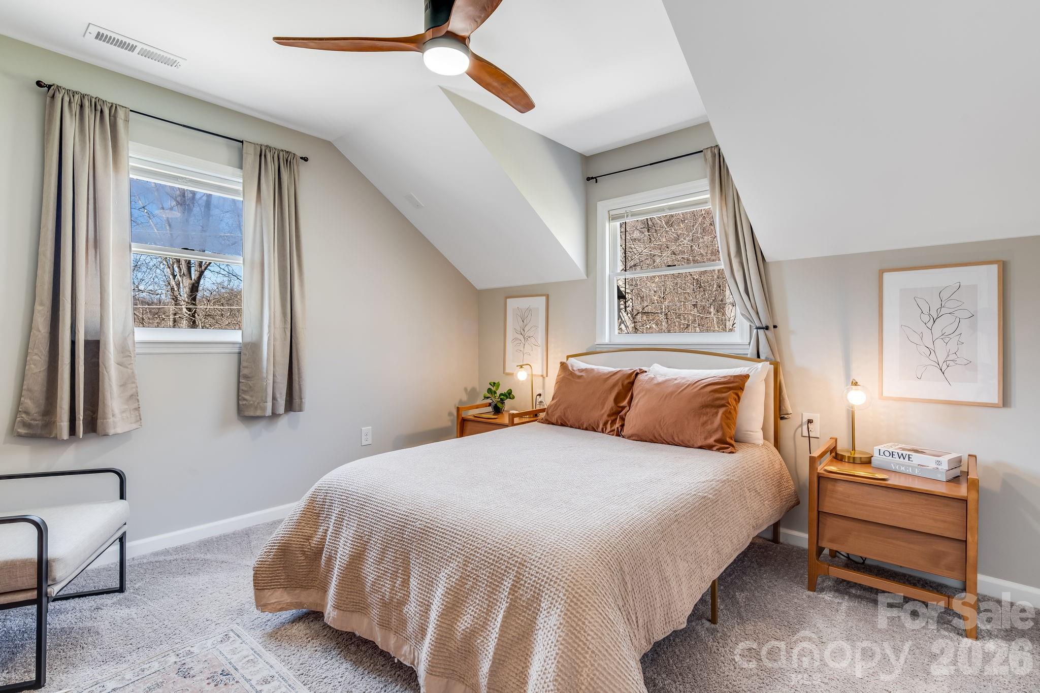 114 Johns Creek Road Canton, NC 28716 - Photo 29 of 48 a bedroom with a bed and a window