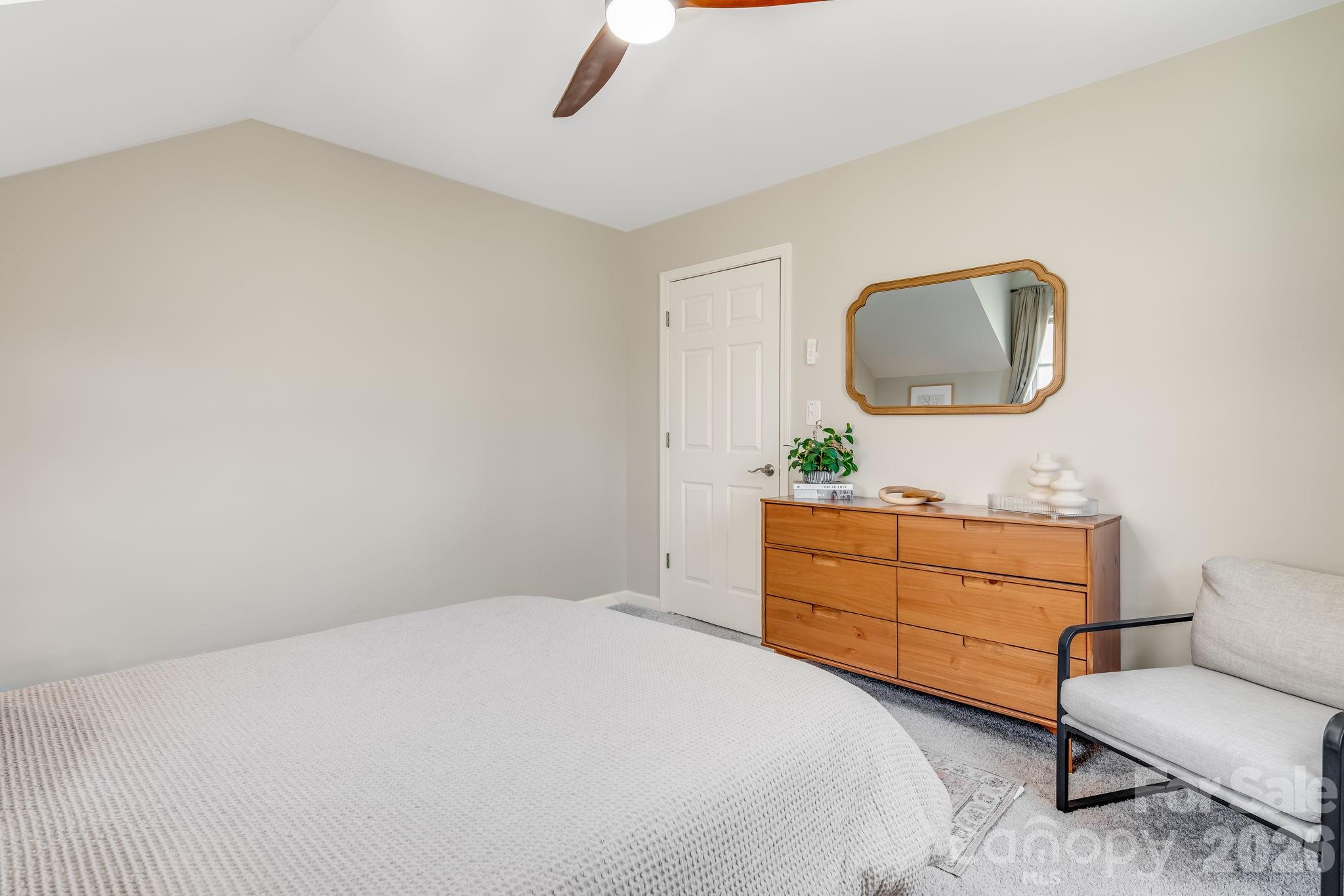 114 Johns Creek Road Canton, NC 28716 - Photo 30 of 48 a bedroom with a bed and a chair