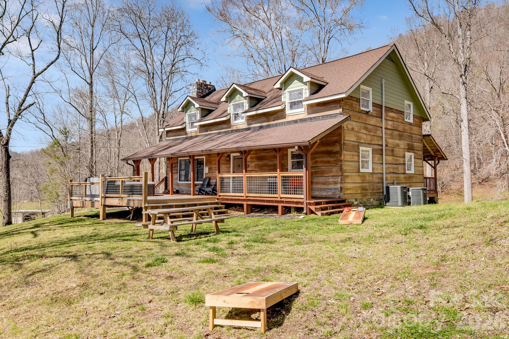 114 Johns Creek Road Canton, NC 28716 - Photo 3 of 48 a view of a house with a yard and sitting area