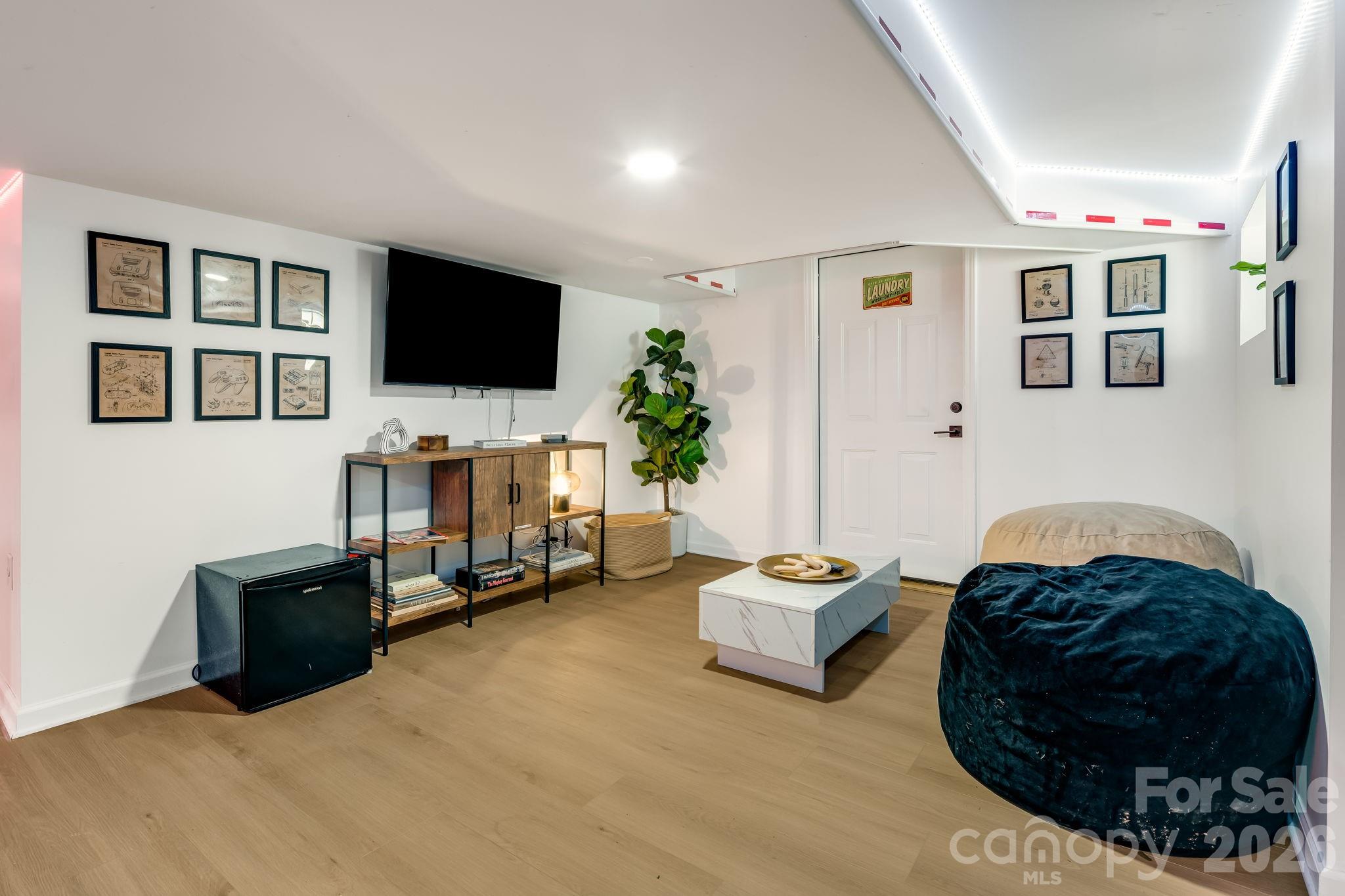 114 Johns Creek Road Canton, NC 28716 - Photo 33 of 48 a living room with furniture and a flat screen tv