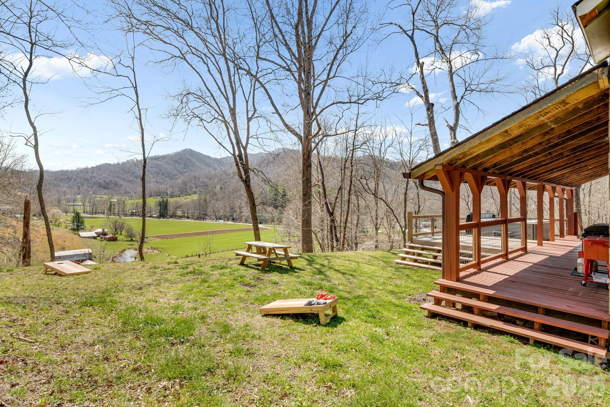 114 Johns Creek Road Canton, NC 28716 - Photo 4 of 48 a view of a house with backyard and sitting area