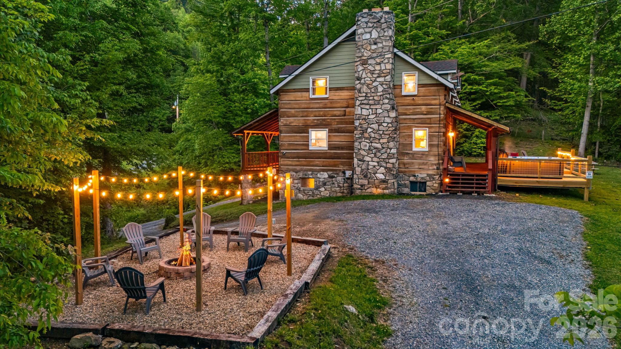 114 Johns Creek Road Canton, NC 28716 - Photo 41 of 48 a view of a house with backyard and sitting area