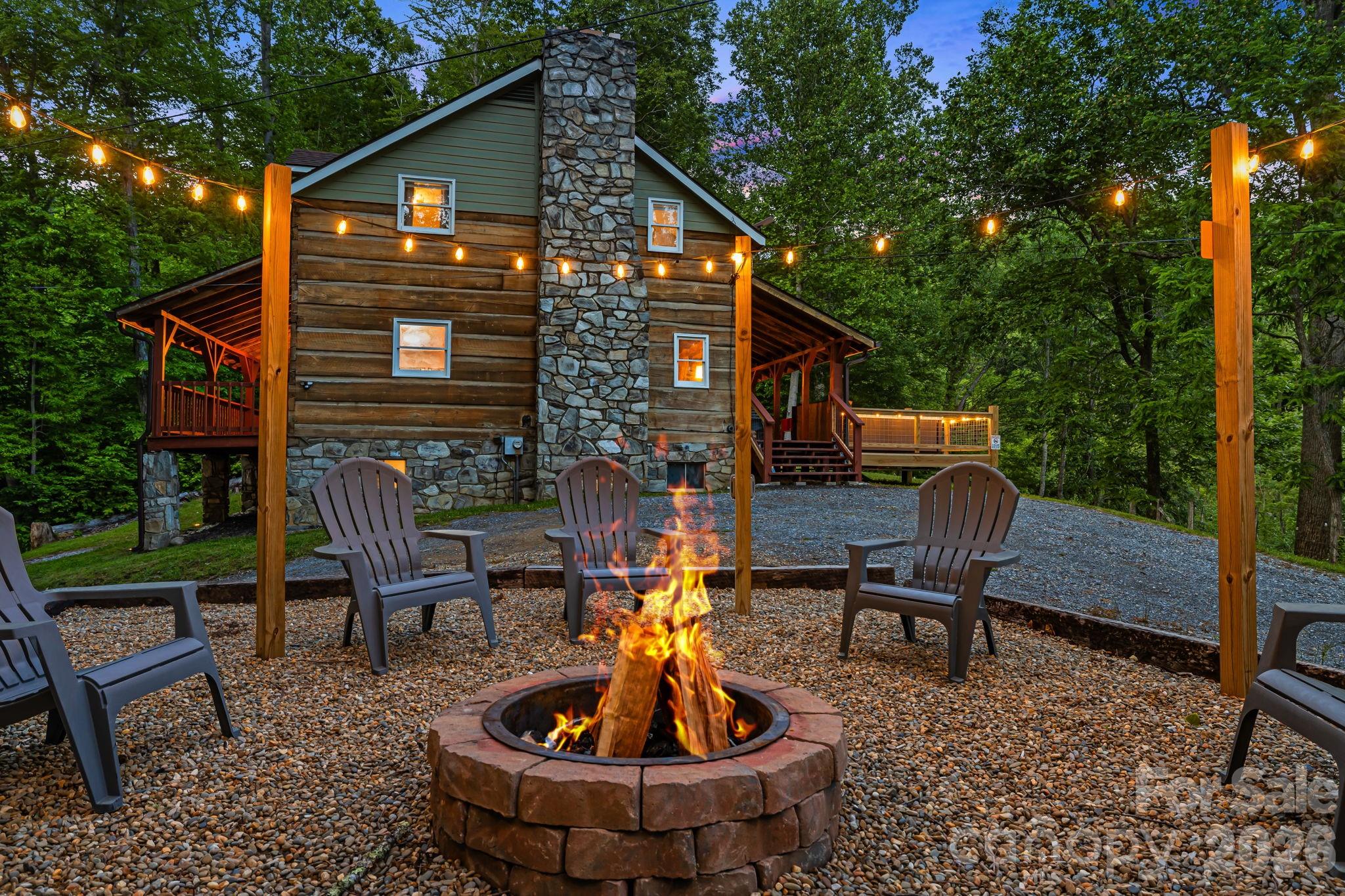 114 Johns Creek Road Canton, NC 28716 - Photo 42 of 48 a wooden bench sitting in front of a house