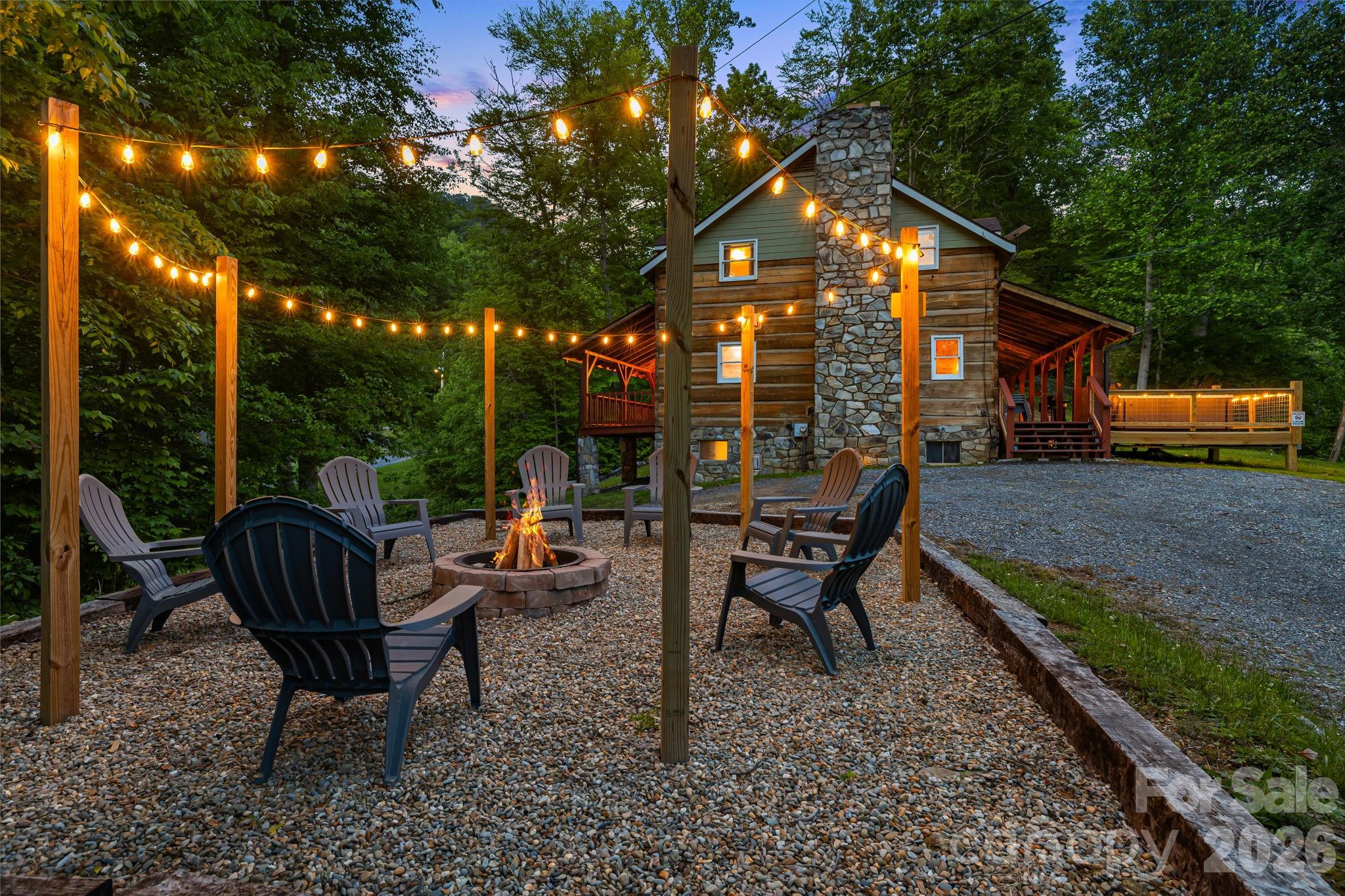 114 Johns Creek Road Canton, NC 28716 - Photo 43 of 48 a backyard of a house with barbeque oven table and chairs