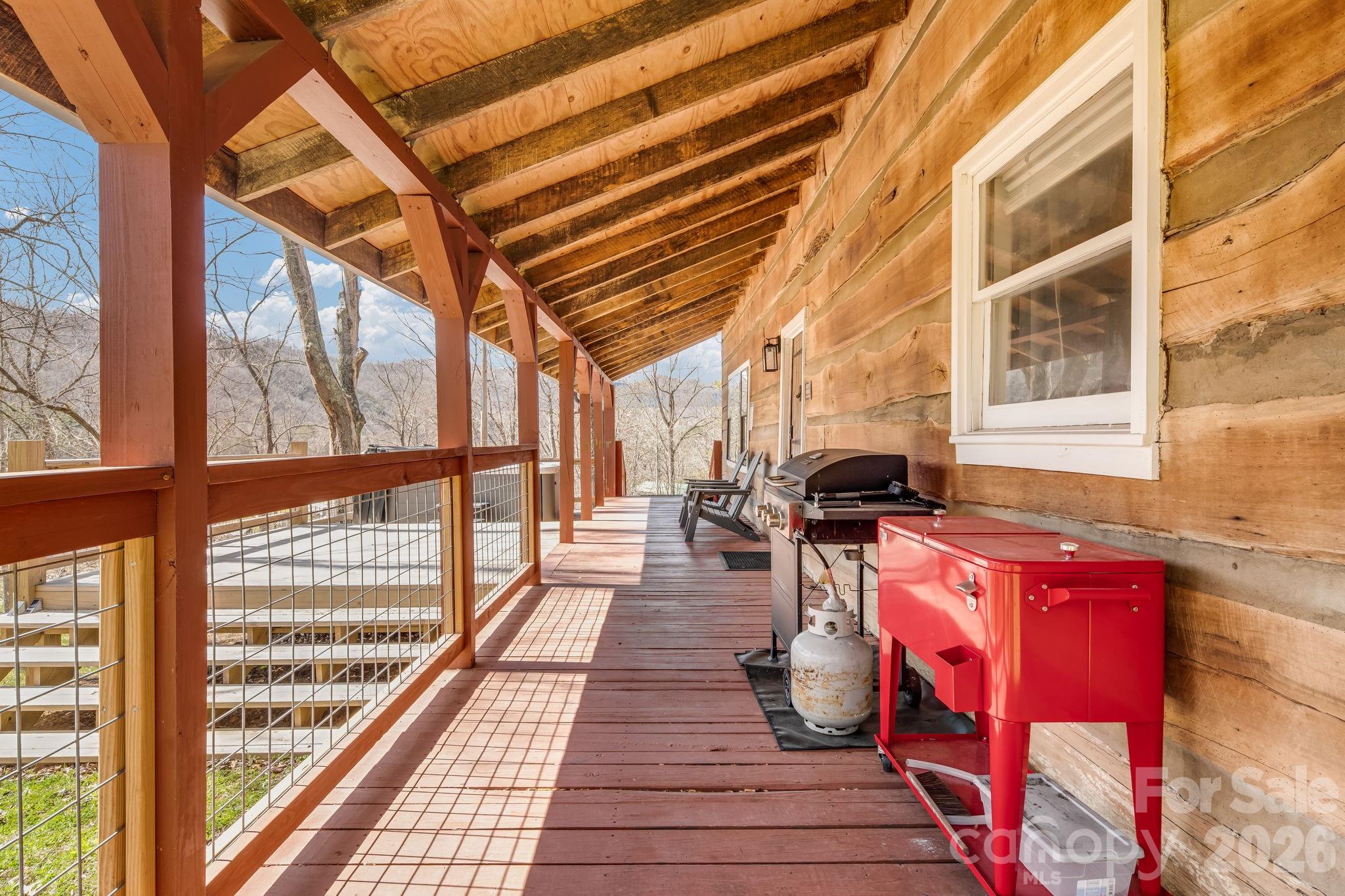 114 Johns Creek Road Canton, NC 28716 - Photo 5 of 48 a sitting area with furniture and wooden floor