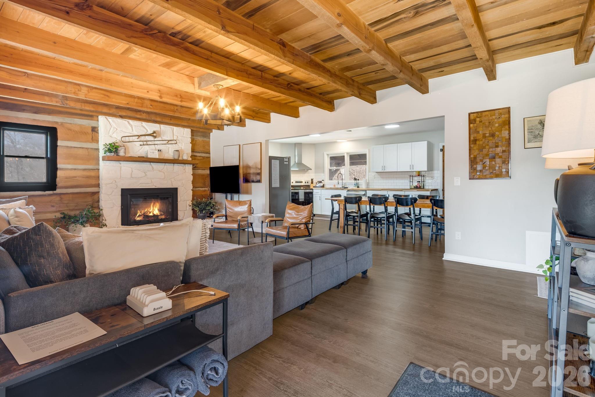 114 Johns Creek Road Canton, NC 28716 - Photo 7 of 48 a living room with furniture and a fireplace