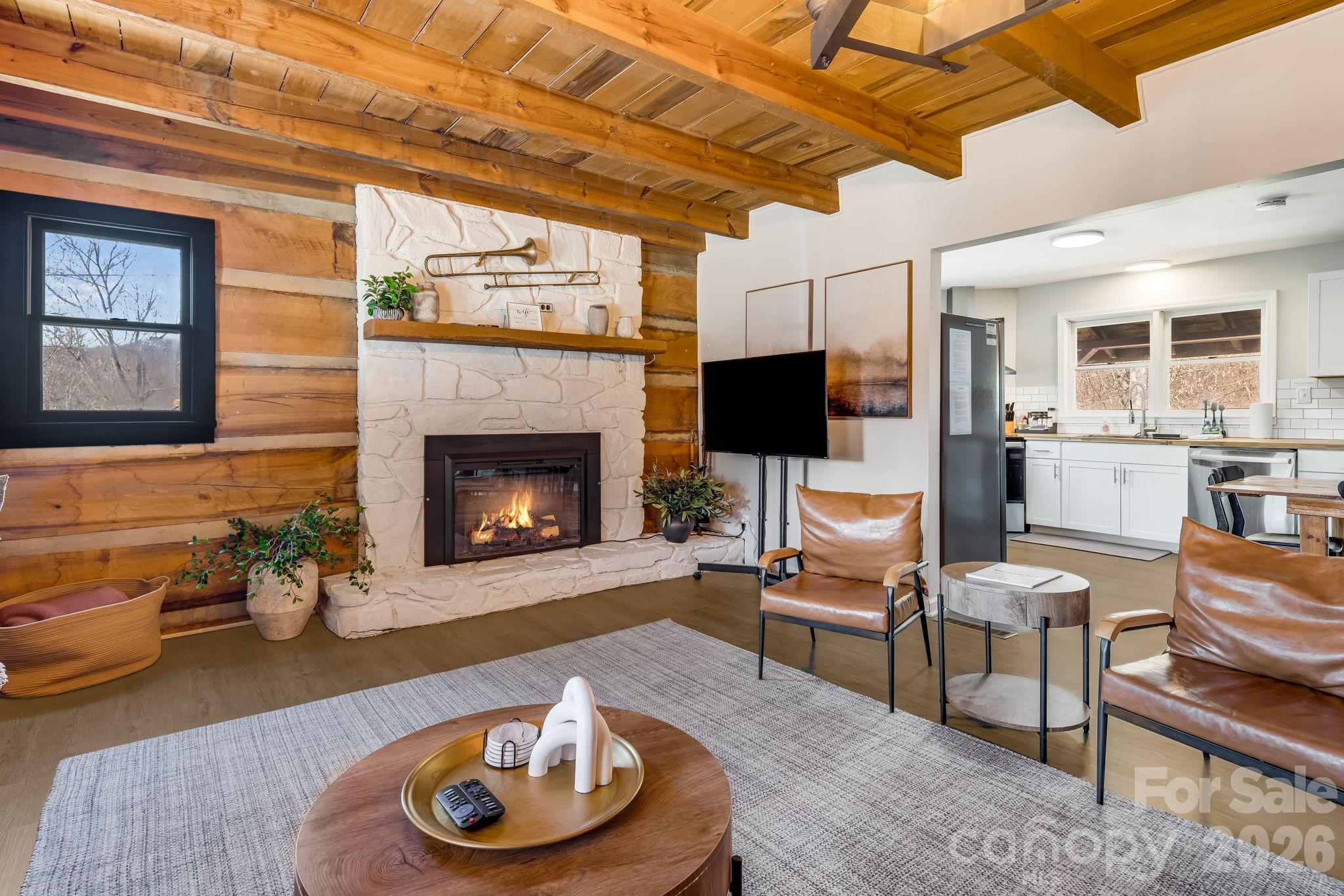114 Johns Creek Road Canton, NC 28716 - Photo 9 of 48 a living room with furniture and a fireplace