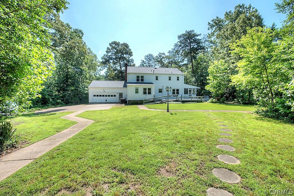 7720 Varann Road Henrico, VA 23231 - Photo 11 of 39 a view of a house with a yard
