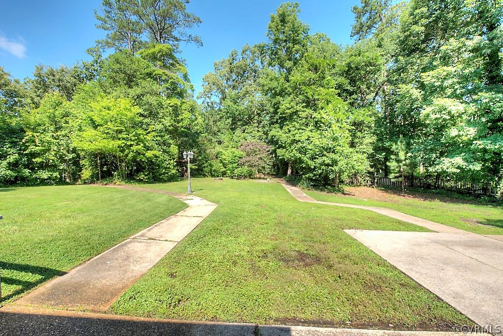 7720 Varann Road Henrico, VA 23231 - Photo 13 of 39 a view of a yard with a large trees