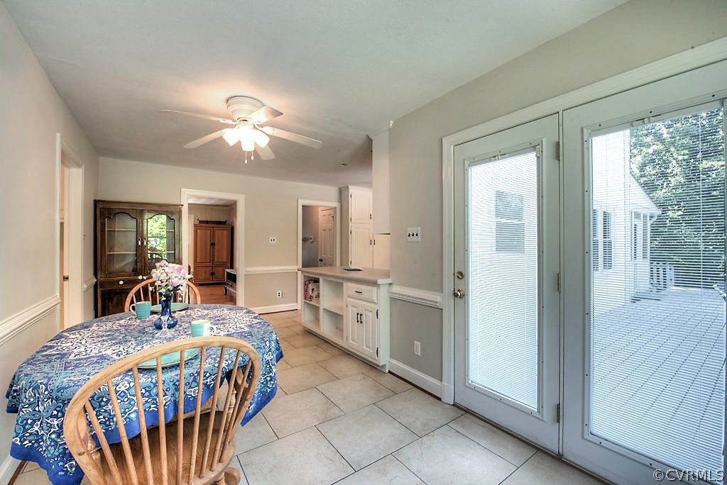 7720 Varann Road Henrico, VA 23231 - Photo 25 of 39 a bed room with a bed and a chandelier