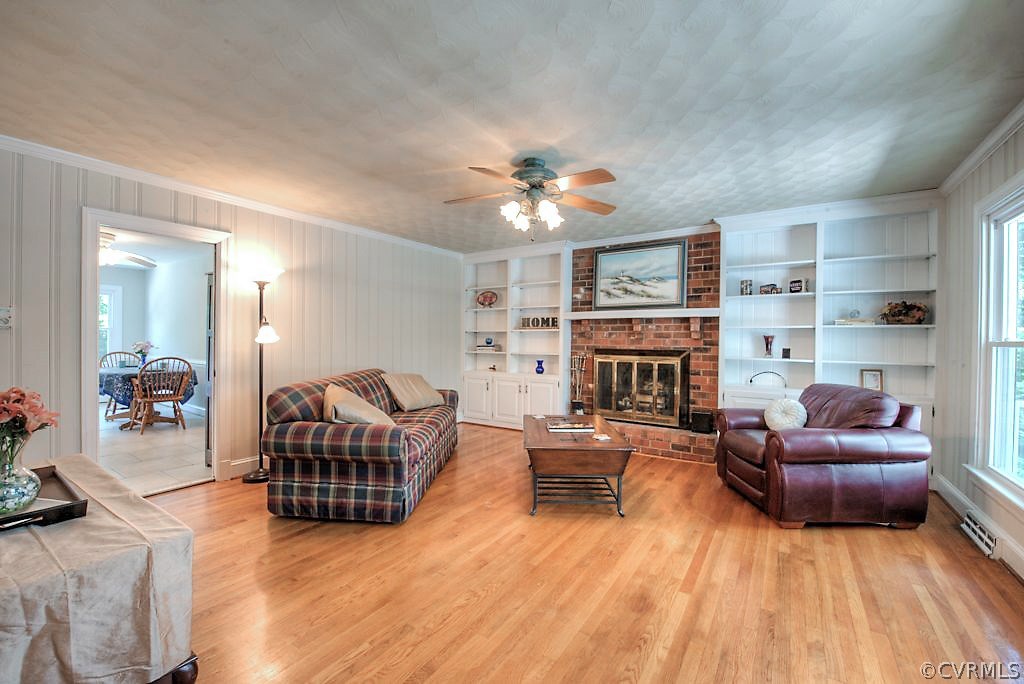 7720 Varann Road Henrico, VA 23231 - Photo 30 of 39 a living room with furniture fireplace and flat screen tv