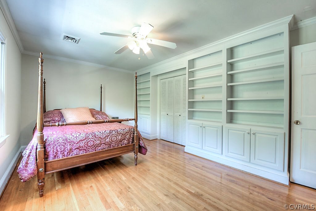 7720 Varann Road Henrico, VA 23231 - Photo 32 of 39 a bedroom with a bed and a chandelier