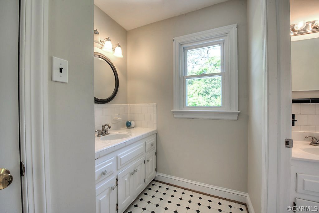 7720 Varann Road Henrico, VA 23231 - Photo 38 of 39 a bathroom with a sink a toilet and a window