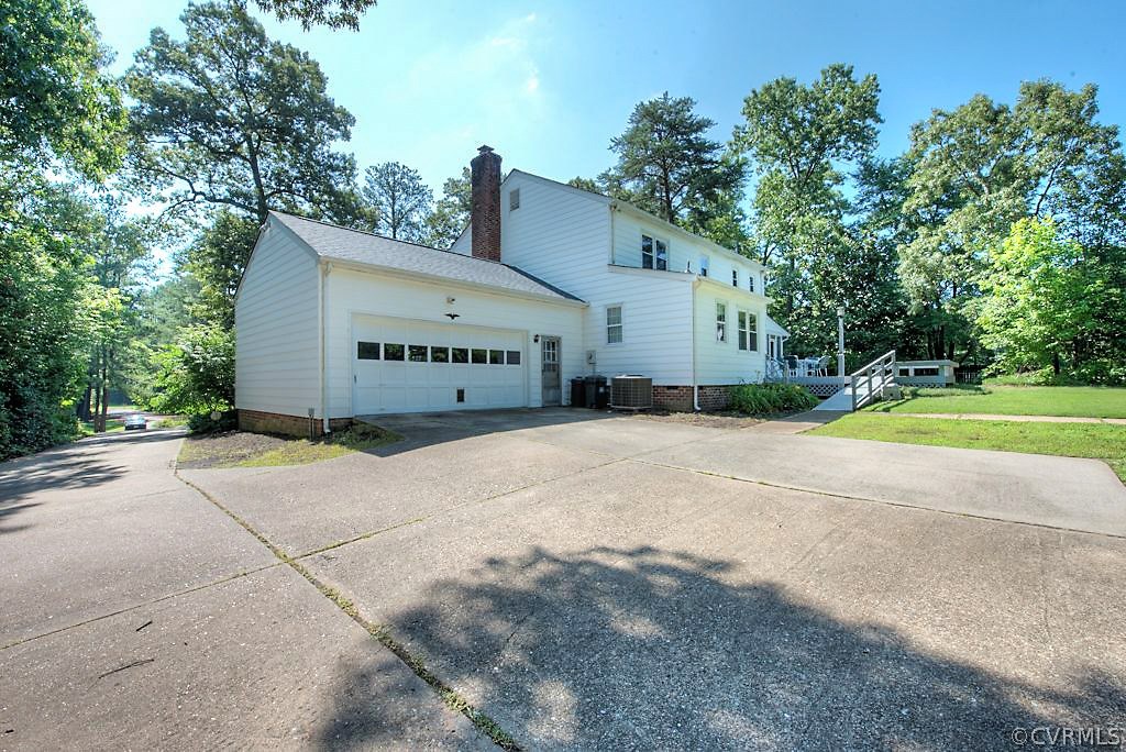 7720 Varann Road Henrico, VA 23231 - Photo 6 of 39 a view of a house with a yard and garage