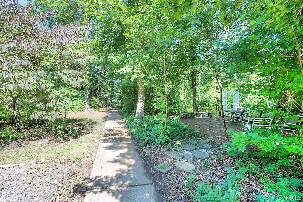 7720 Varann Road Henrico, VA 23231 - Photo 7 of 39 a view of a pathway both side of yard