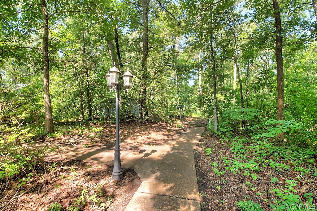 7720 Varann Road Henrico, VA 23231 - Photo 9 of 39 a backyard of a house with lots of green space
