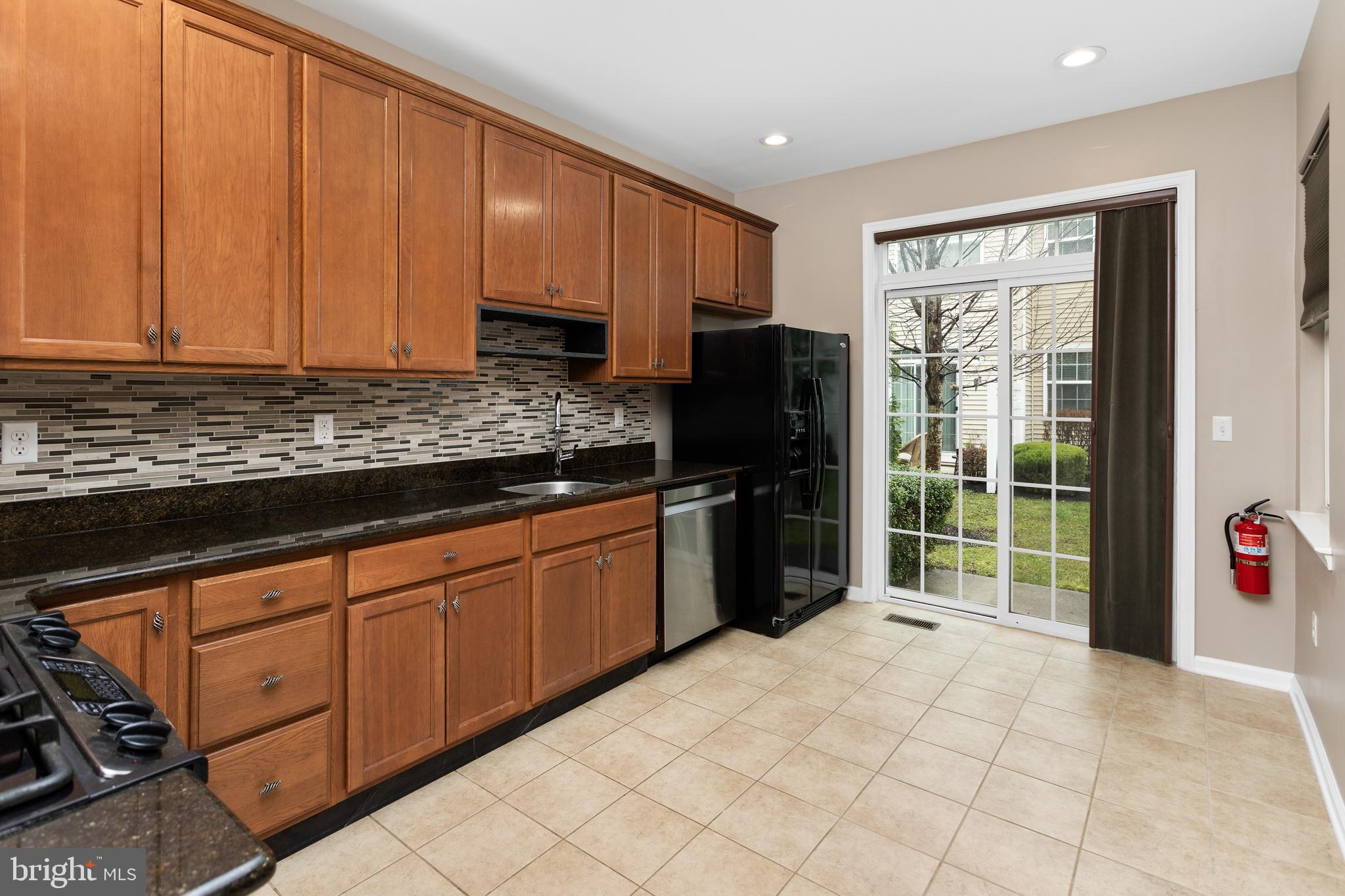 6 Flagger Lane Hamilton, NJ 08619 - Photo 11 of 32 a kitchen with stainless steel appliances granite countertop a refrigerator and a sink