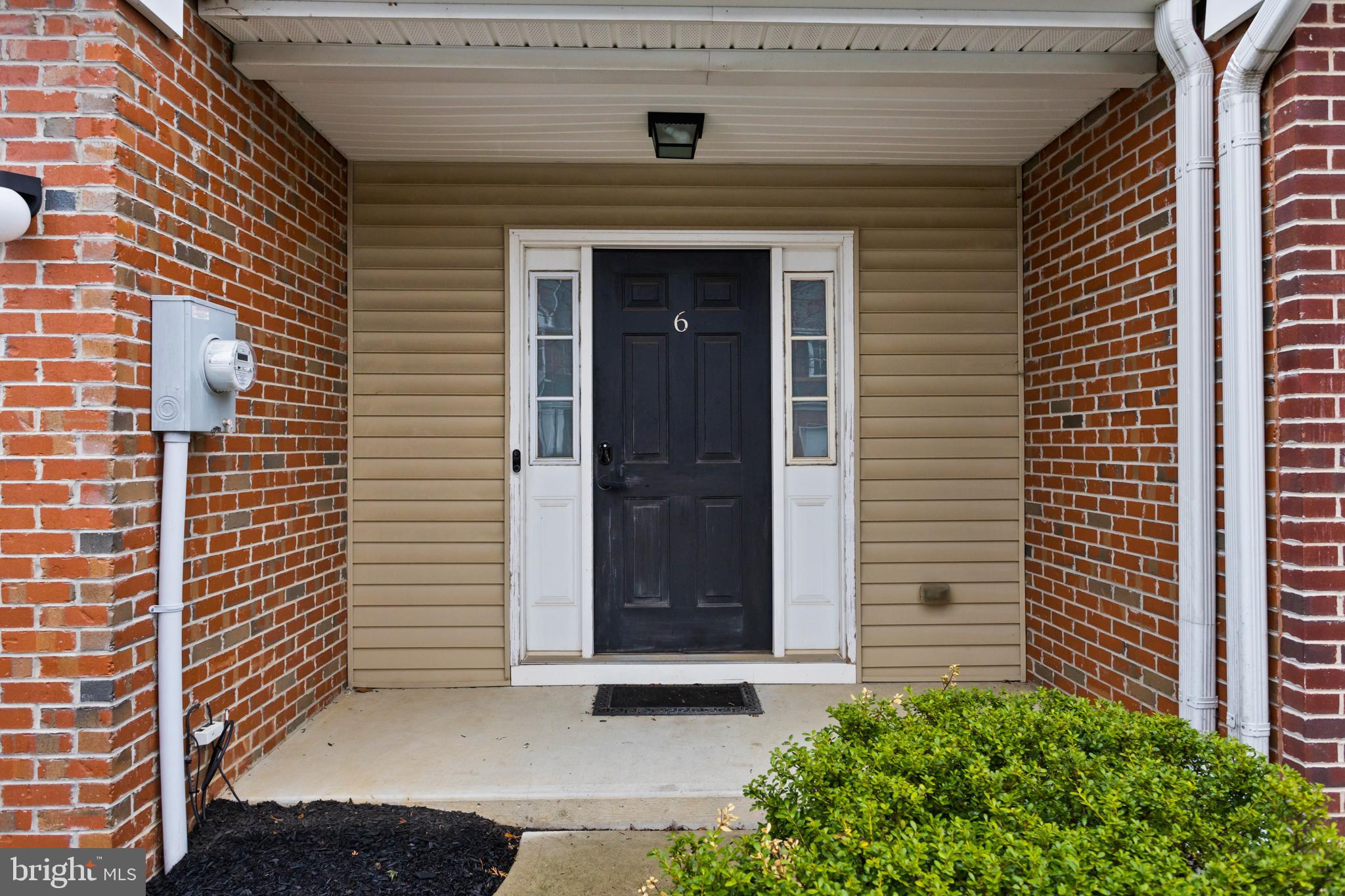 6 Flagger Lane Hamilton, NJ 08619 - Photo 2 of 32 a front view of a house with a garage