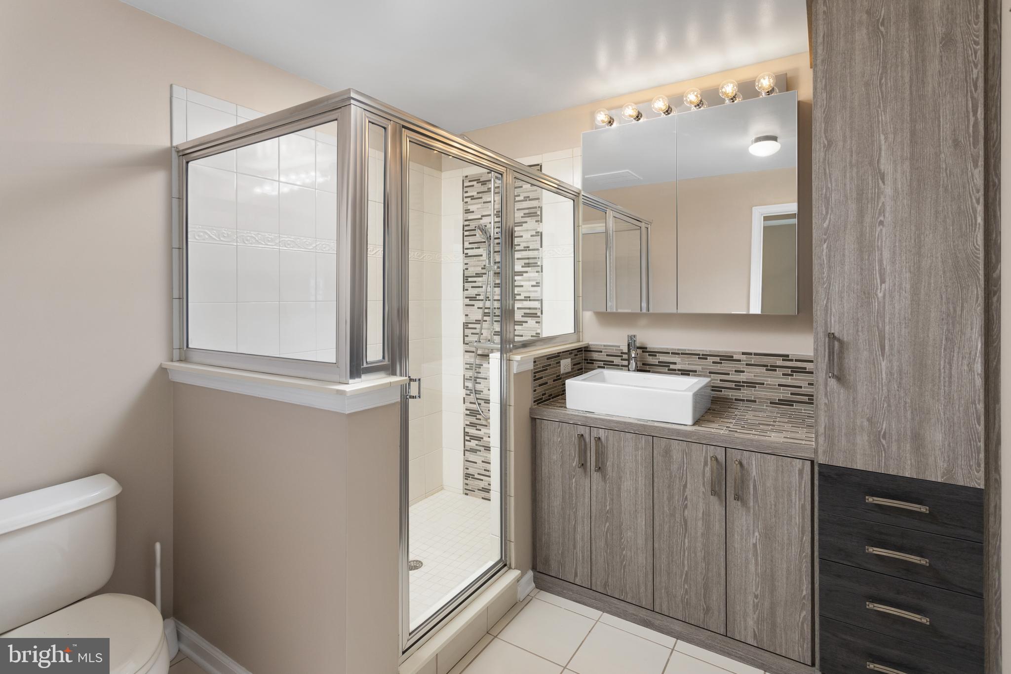 6 Flagger Lane Hamilton, NJ 08619 - Photo 21 of 32 a bathroom with a sink a toilet and vanity