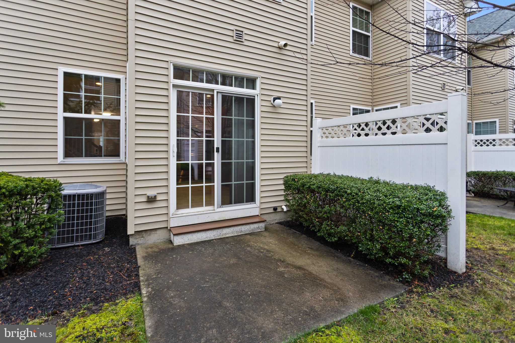 6 Flagger Lane Hamilton, NJ 08619 - Photo 31 of 32 a view of a house with potted plants and a yard