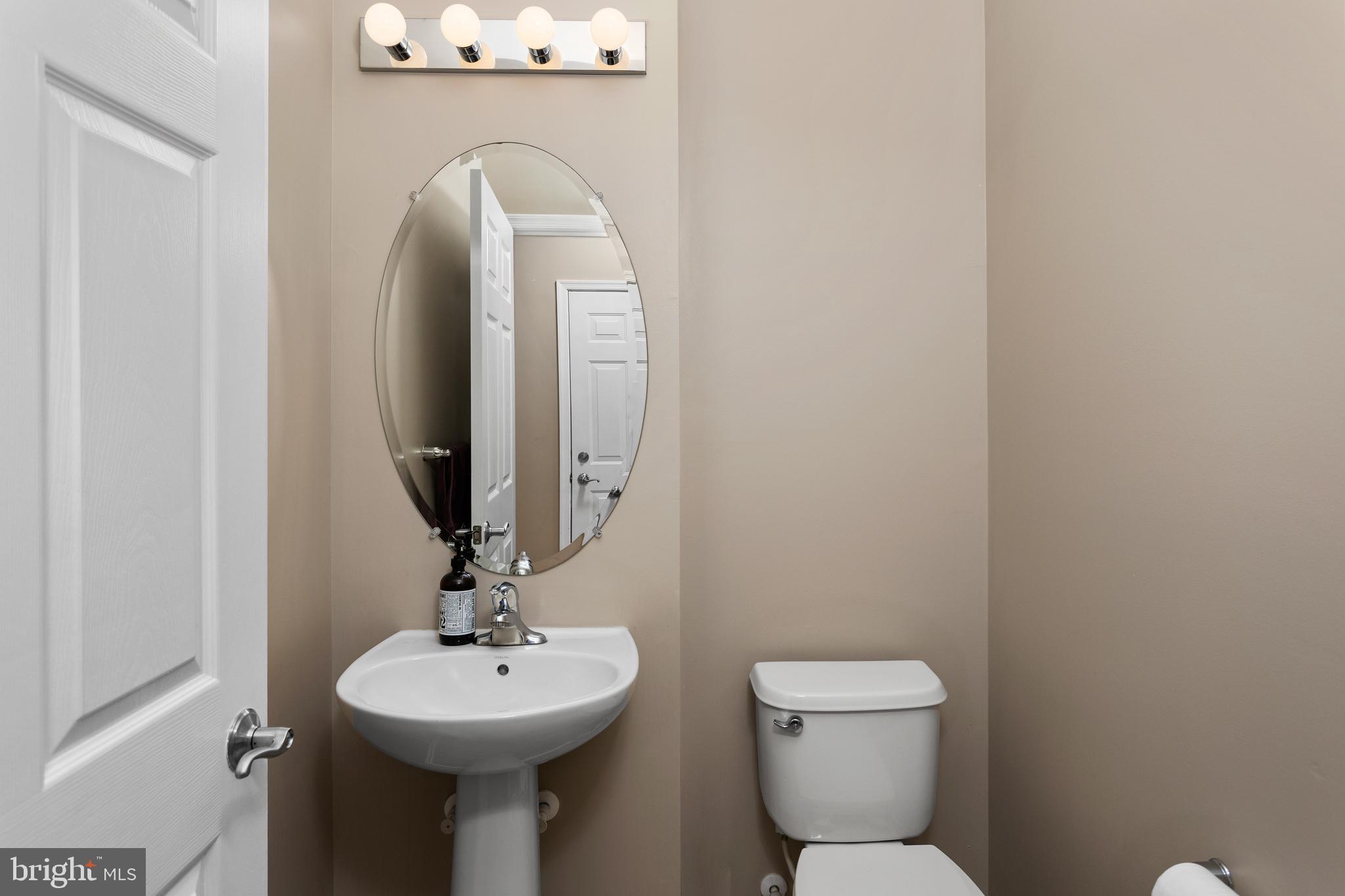 6 Flagger Lane Hamilton, NJ 08619 - Photo 4 of 32 a bathroom with a toilet sink and mirror