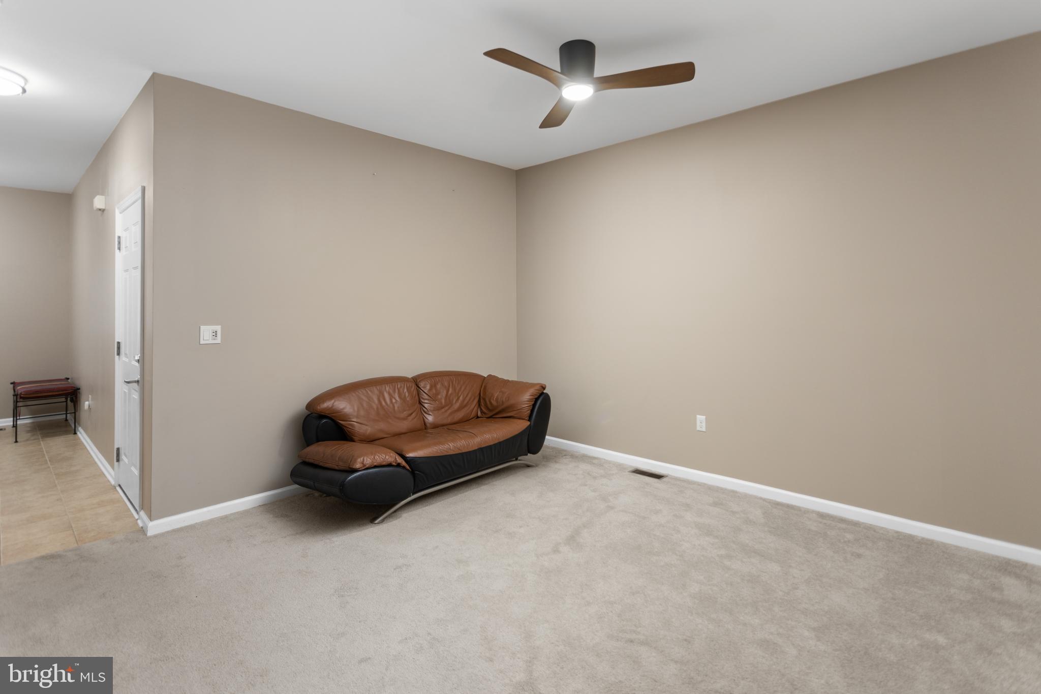 6 Flagger Lane Hamilton, NJ 08619 - Photo 6 of 32 an empty room with a ceiling fan